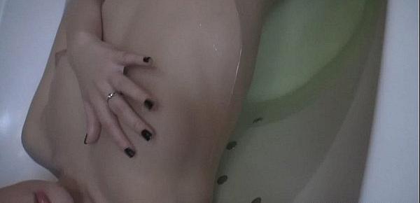  Beautiful girl teases us from the bath